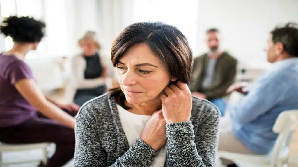 A mature woman in group therapy