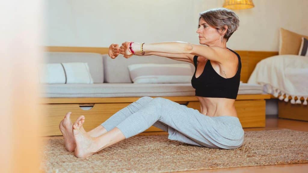 A woman stretching at home