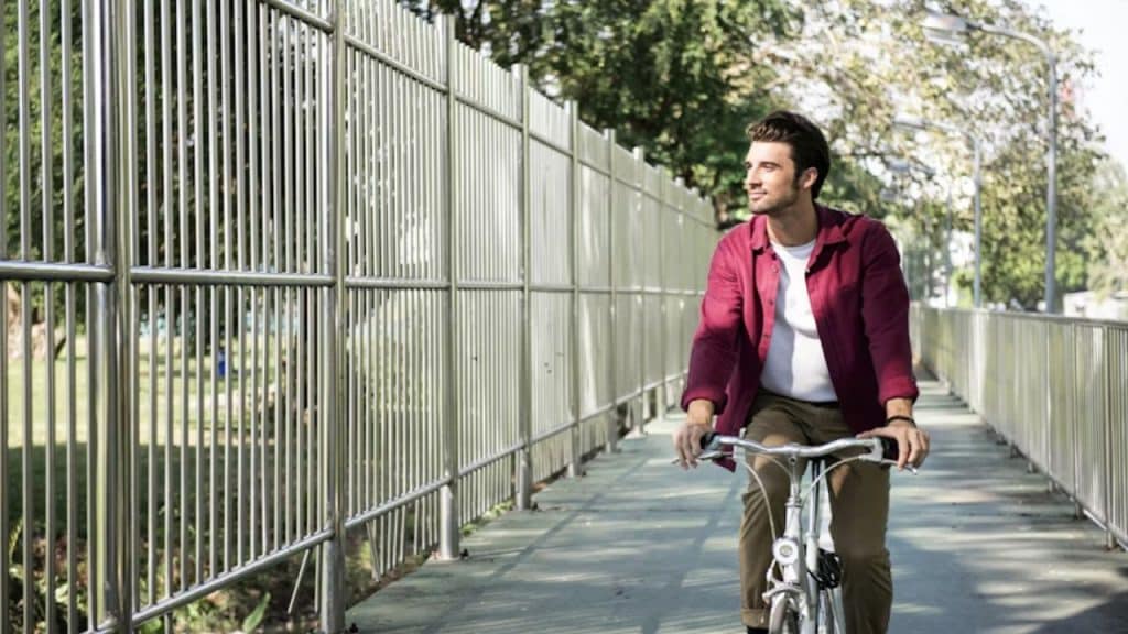 Man cycling alone outdoors in nature