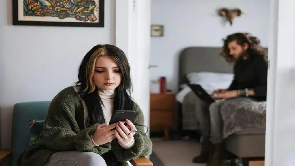 A couple ignoring each other at home