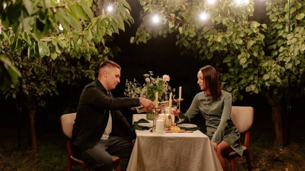 Couple sitting stiffly during an awkward dinner