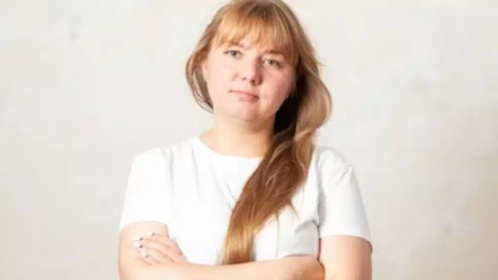 Woman with arms crossed feeling annoyed