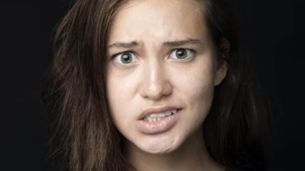 Woman woman reacting with a half smile