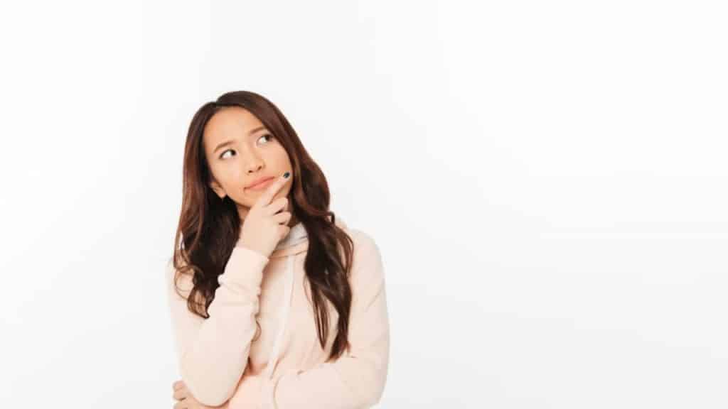 Woman having second thoughts of sharing the bill