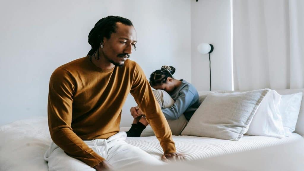 A couple looking upset at home