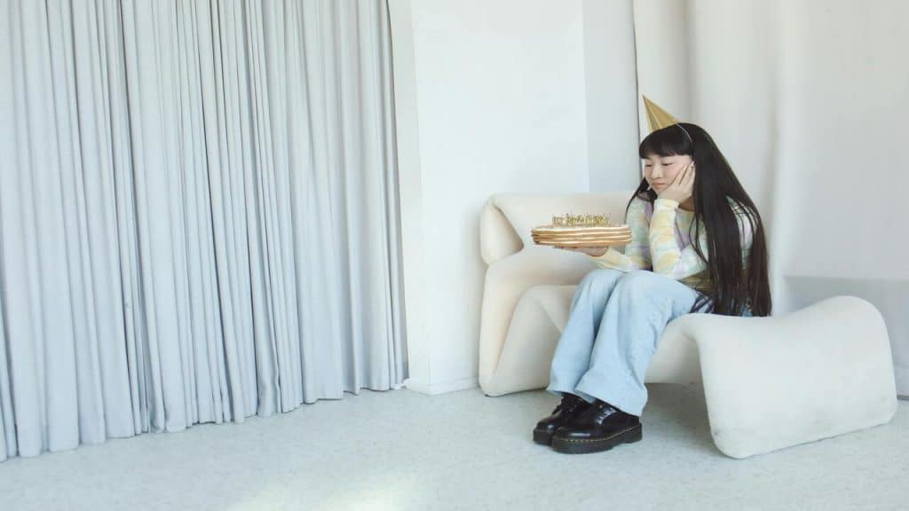 A woman looking sad during her birthday