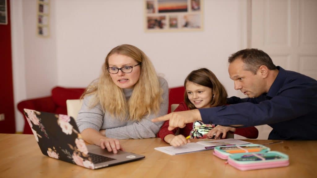 Parents helping their kid study