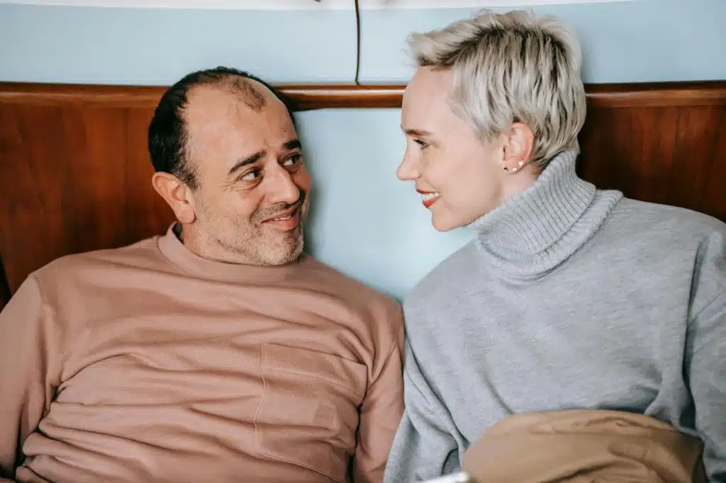 A man and woman looking at each other 