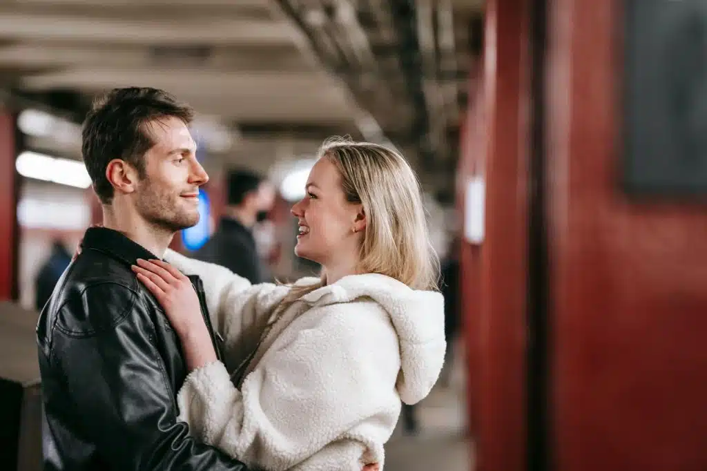A man and woman facing each other
