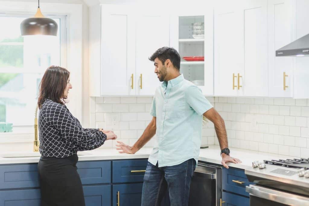 A man and woman at the kitchen