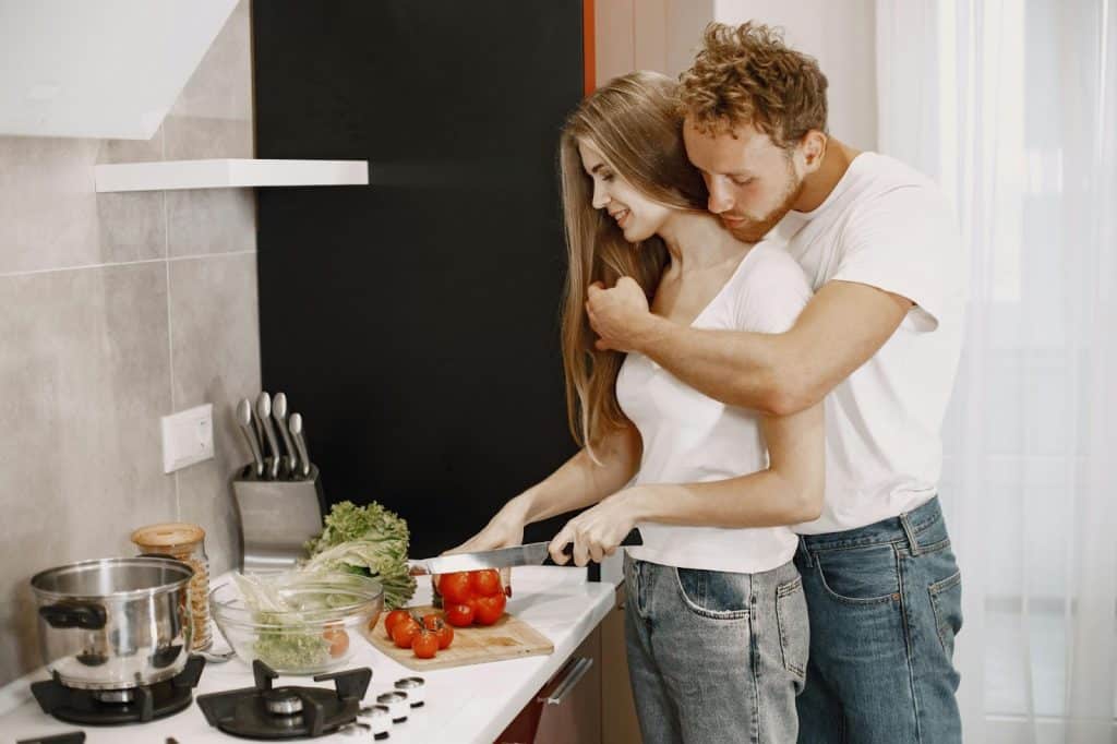 A man hugging a woman