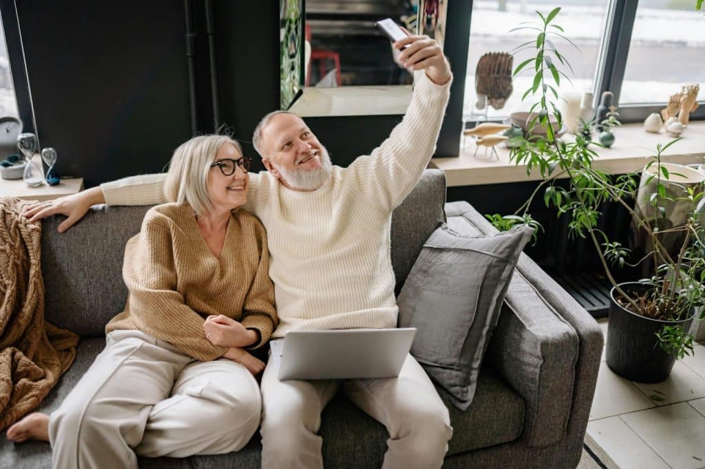 A man and woman taking a picture