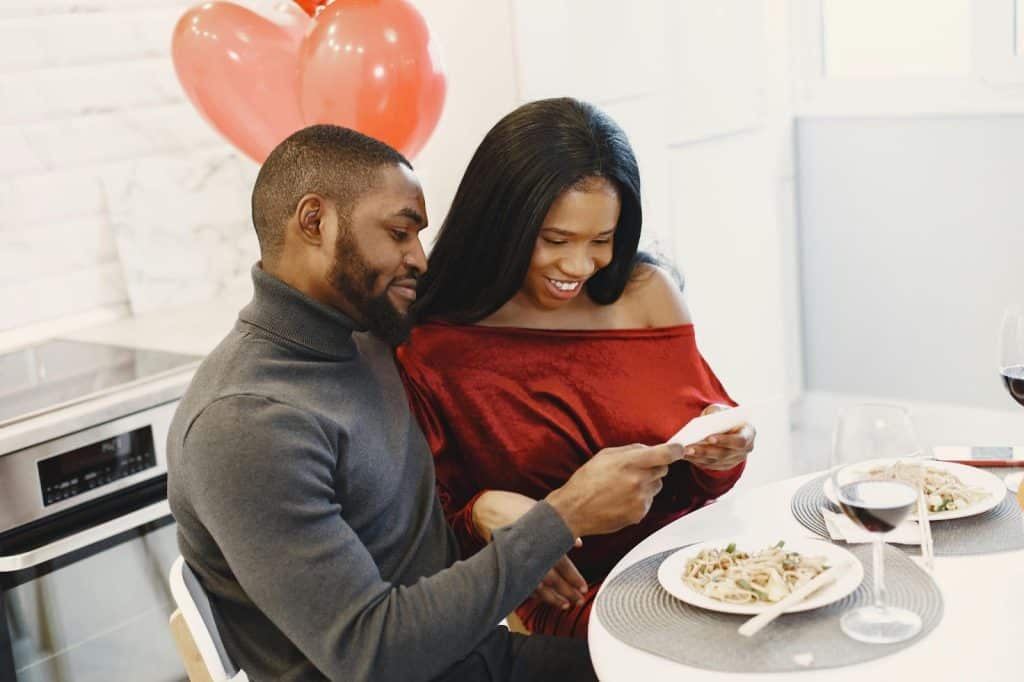 A man showing something to woman