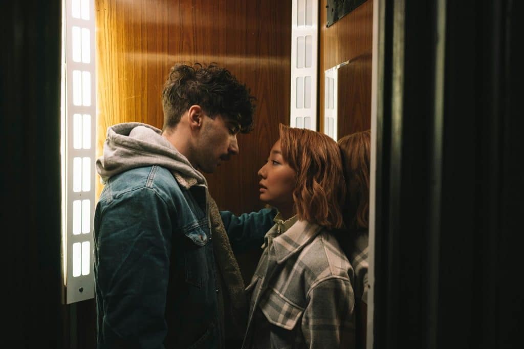 A man and woman facing each other