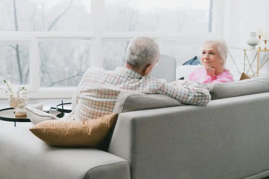 A man and woman at the couch