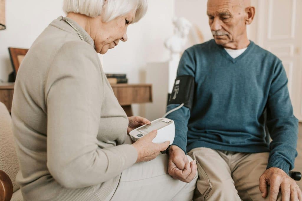 A man and woman checking their health