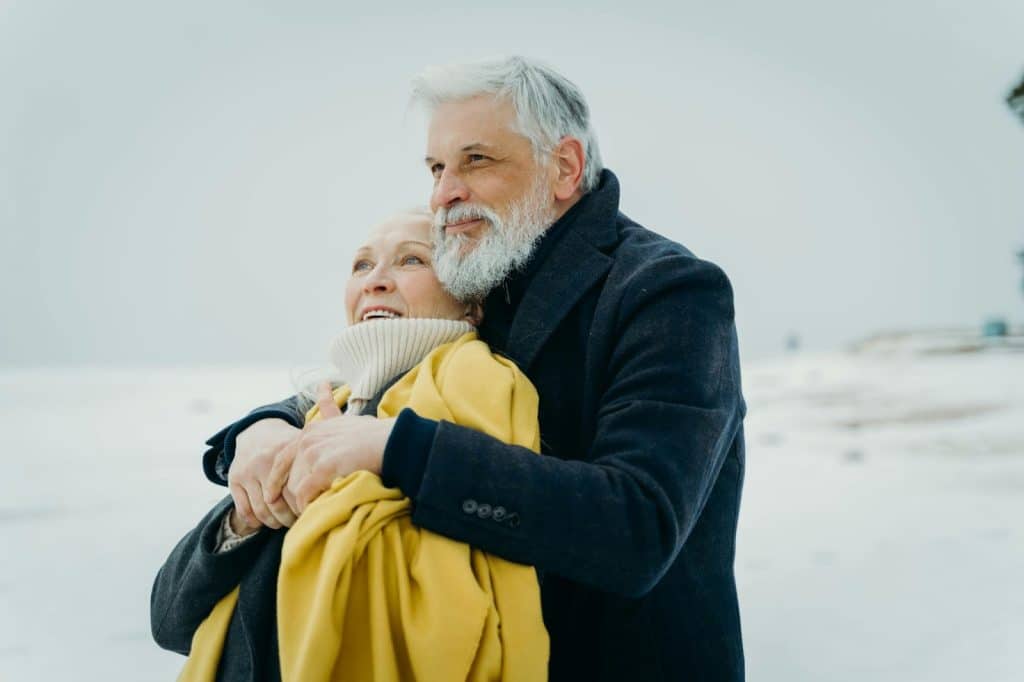 A man and woman hugging each other