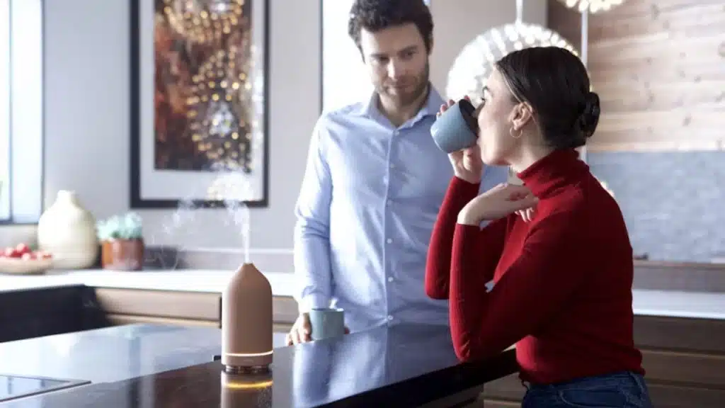 Man speaking while woman looks away distracted