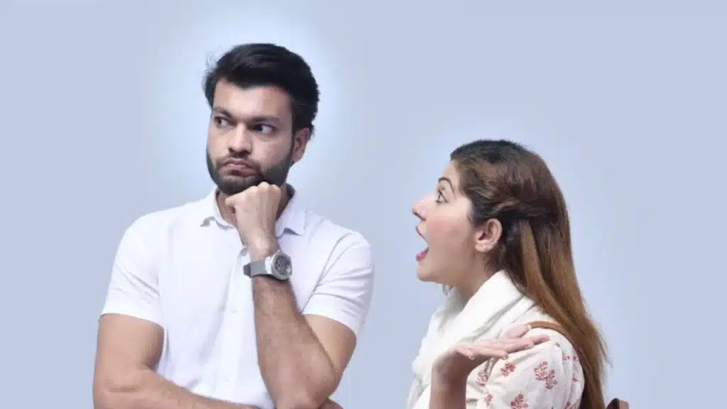 Woman talking rapidly while man looks surprised