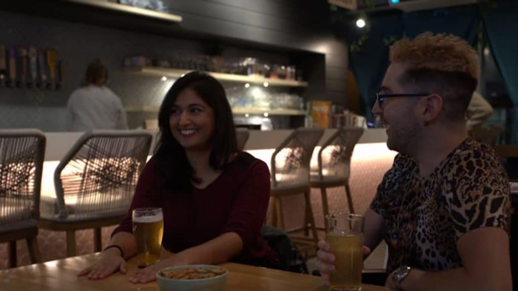 Woman avoiding meaningful conversation with forced smiles and can’t maintain eye contact