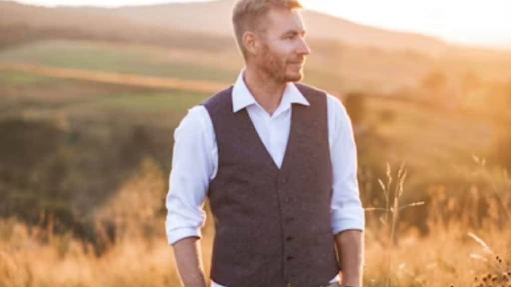Man standing confidently outdoors with straight posture