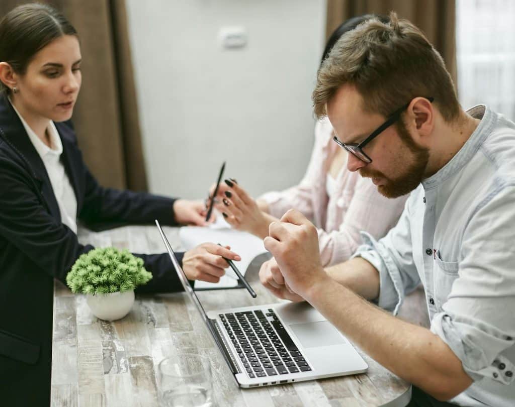 couple  talking to an agent of insurance