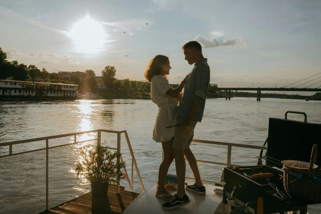 A man and woman at the yacht having fun