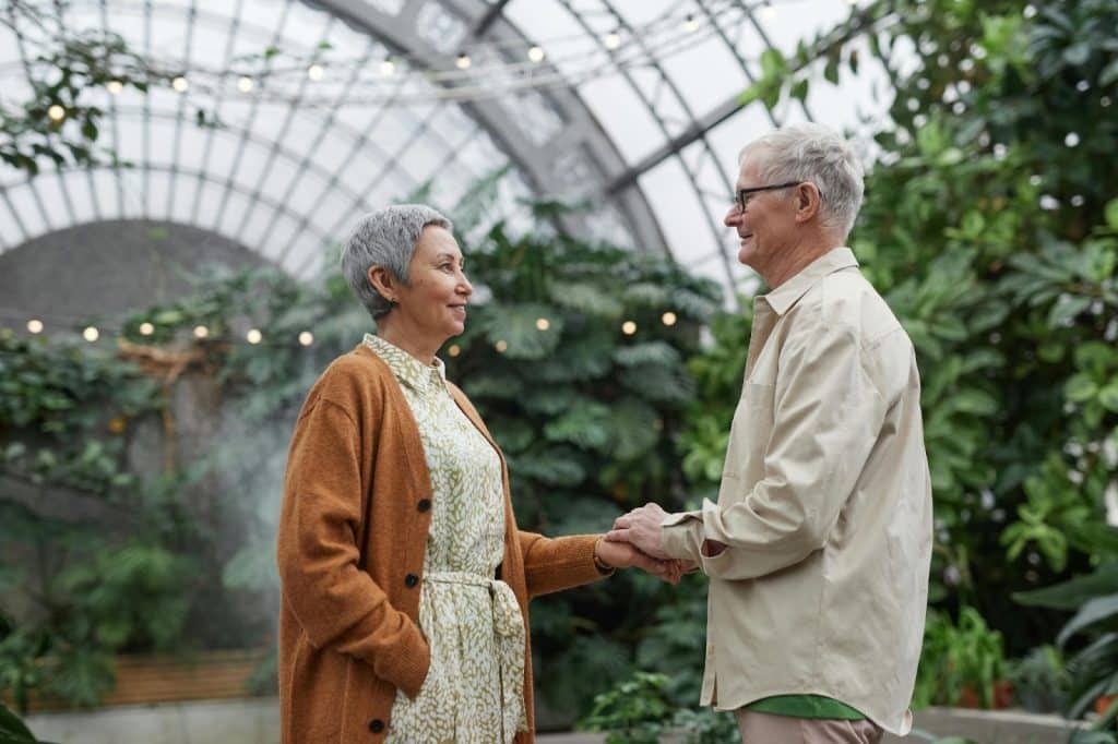 A man and woman looking at each other 