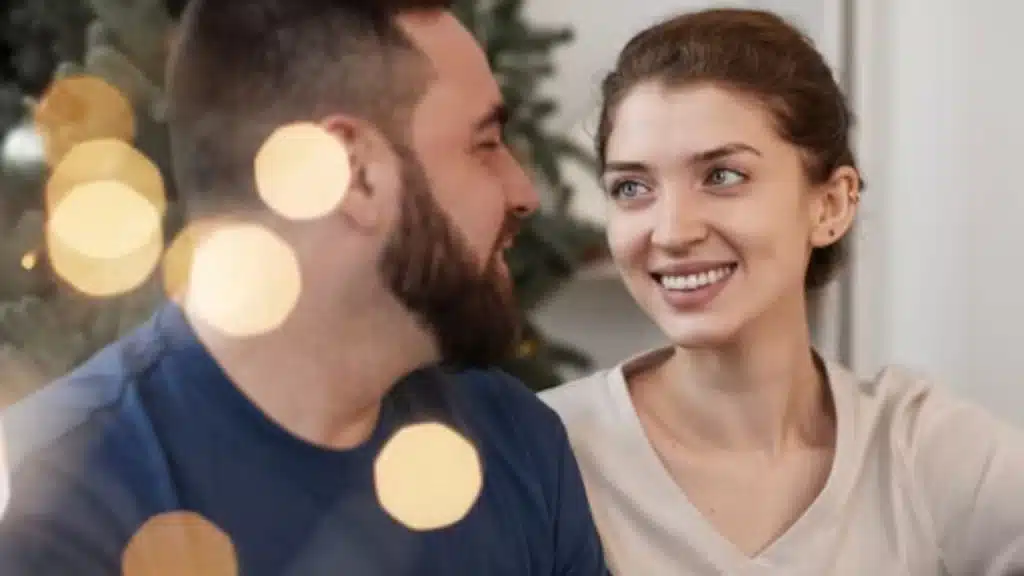 Man smiling at partner while thanking her
