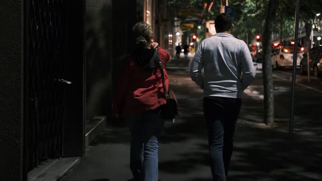 Couple walking side by side without holding hands