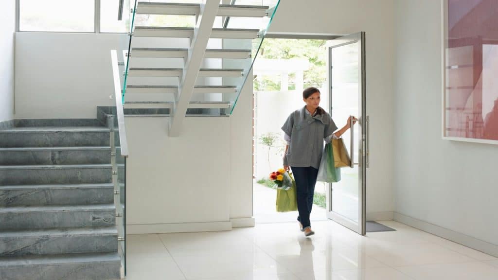 A woman entering a home without invitation