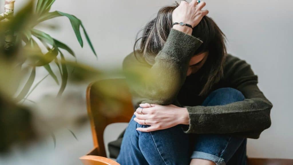 A woman looking upset at home
