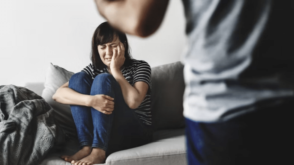 A couple in a tense standoff after an argument in the living room