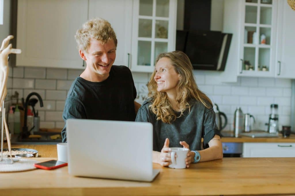 A man and woman smiling together