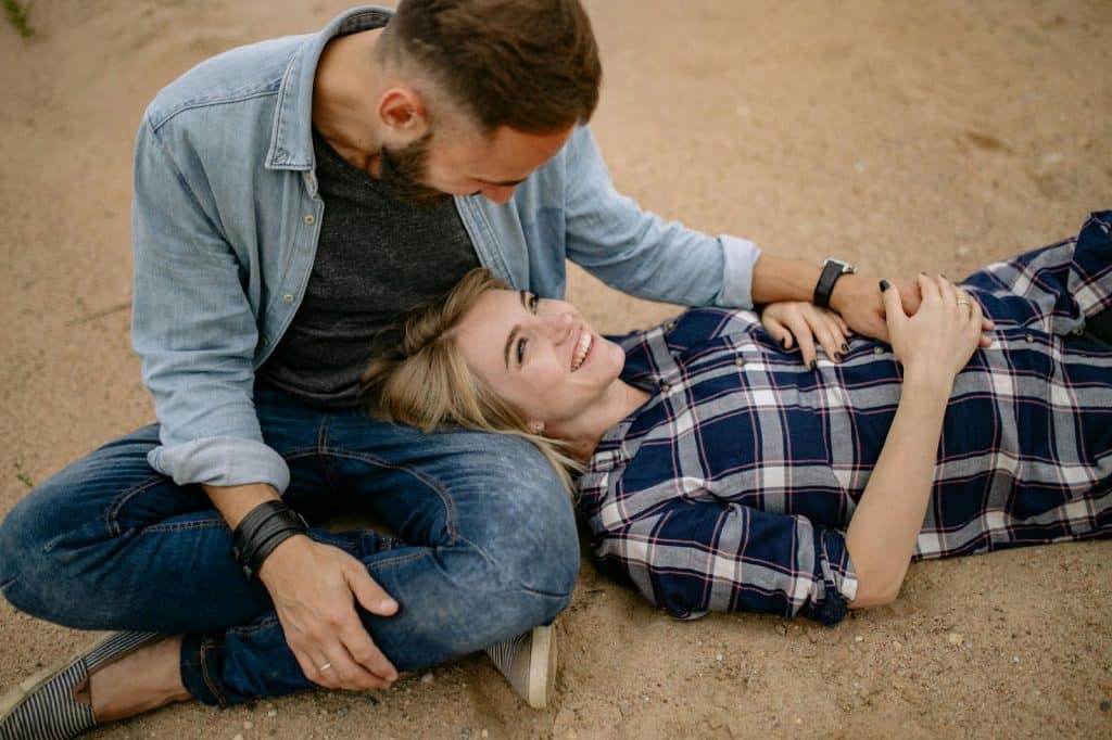 A Man letting a woman to lay on his lap