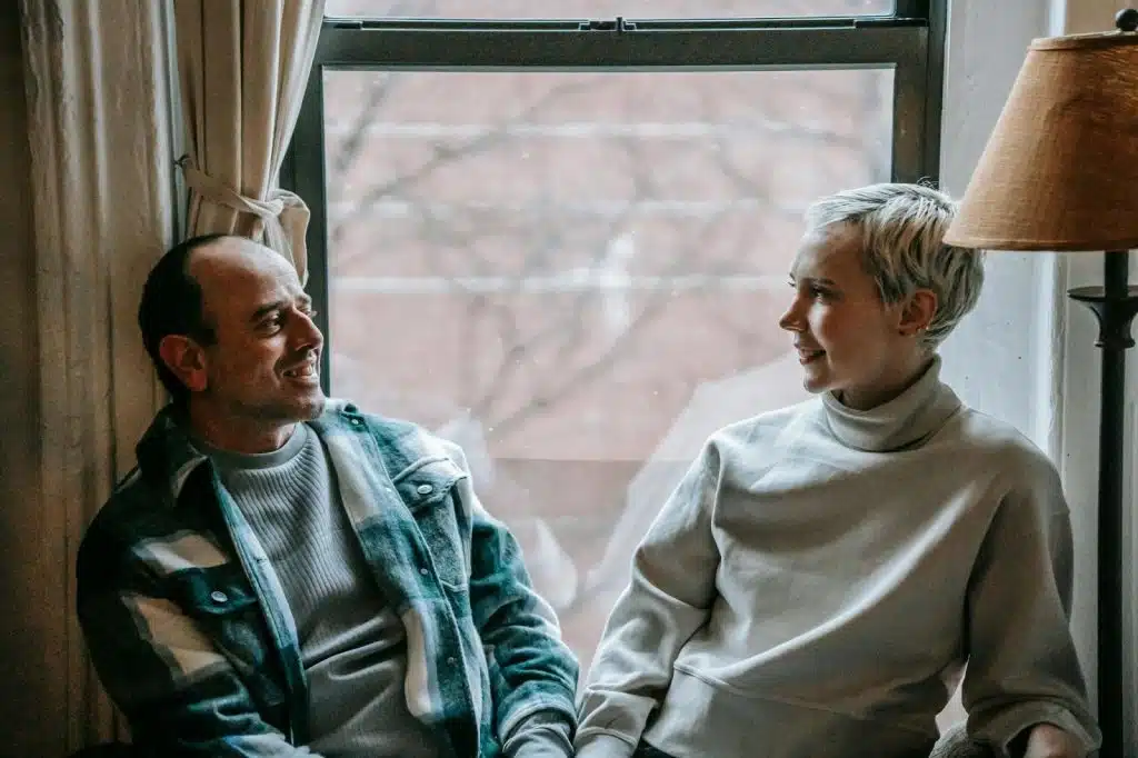 A man and woman at the window