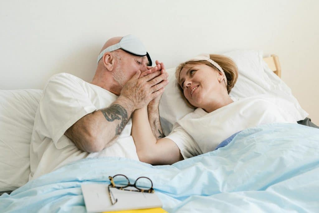 A man kissing a woman’s hand