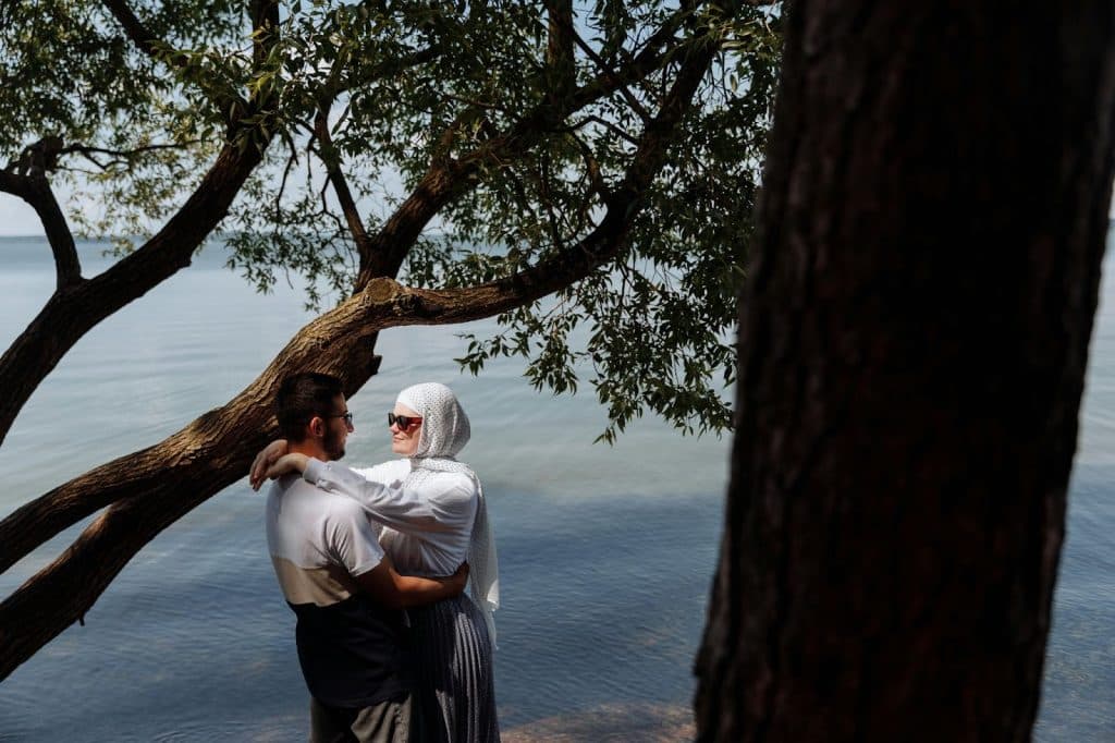 A man and woman facing each other