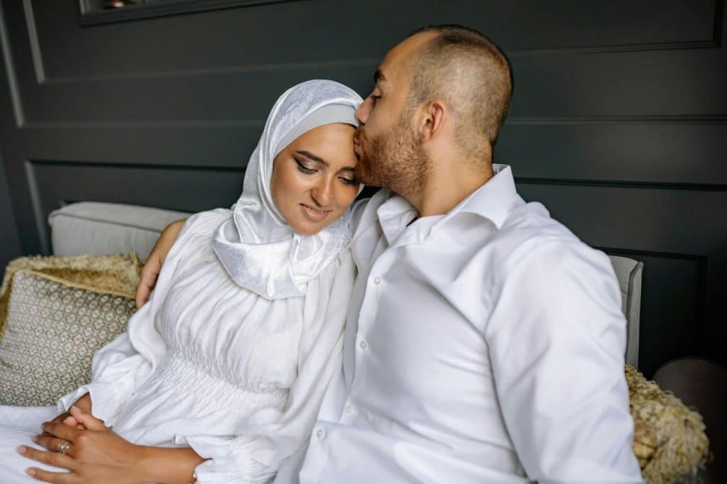 A man kissing a woman’s power