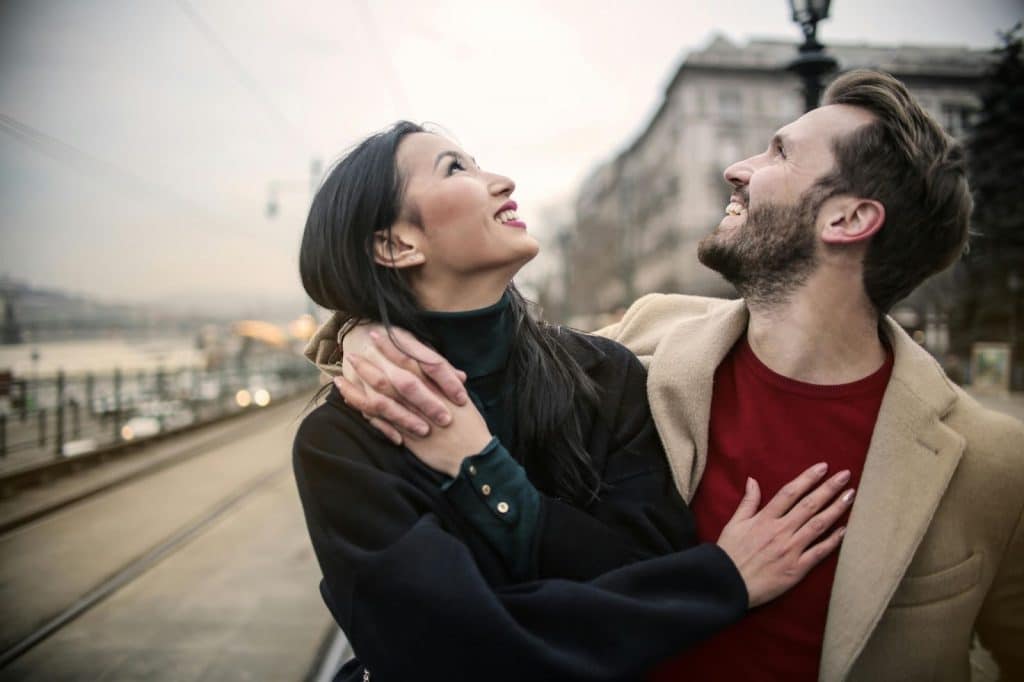 A man and woman looking up