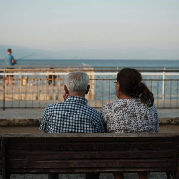 A couple sitting on the bench