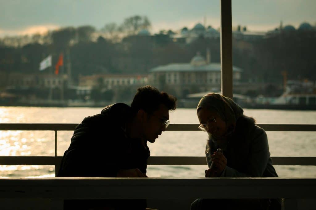 A man encouraging woman to talk