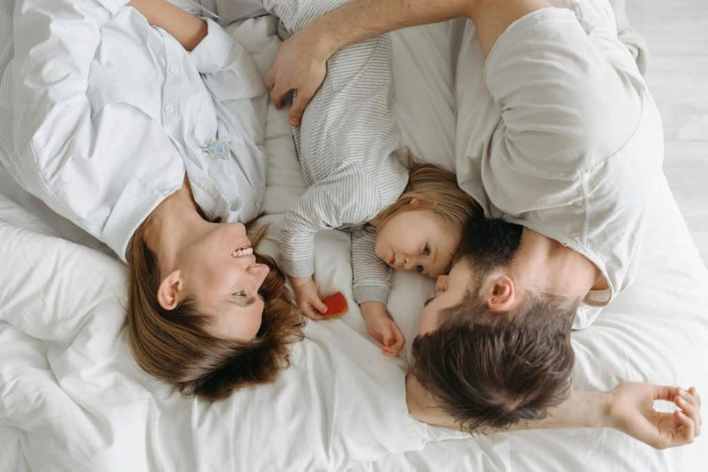 A man and woman  with their child