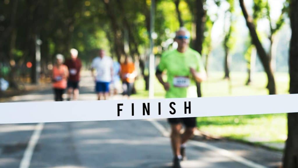 A runner approaching the finish line in a race.