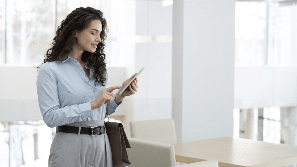 A woman texting at work