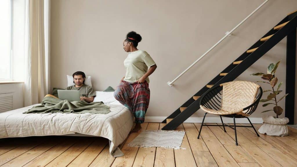 A couple talking in the bedroom