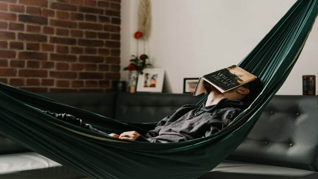 A man relaxing on a hammock
