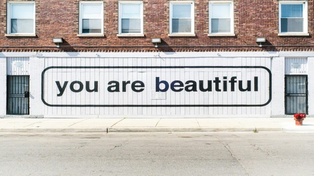 A sign saying “you are beautiful”