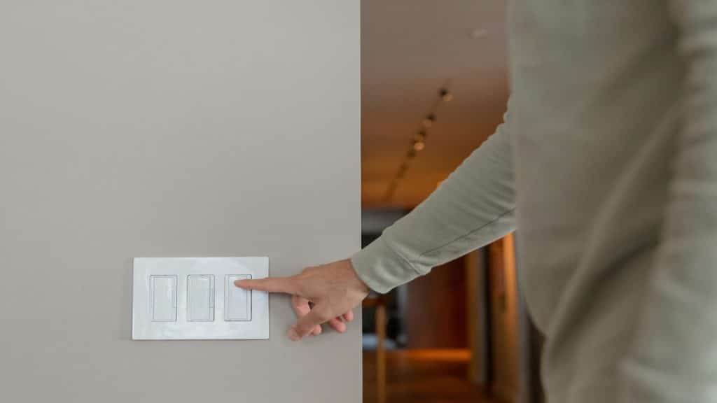 A man turning off the lights