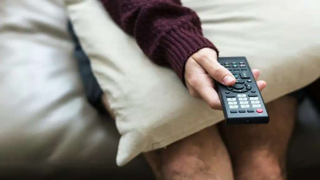 A man using a remote control